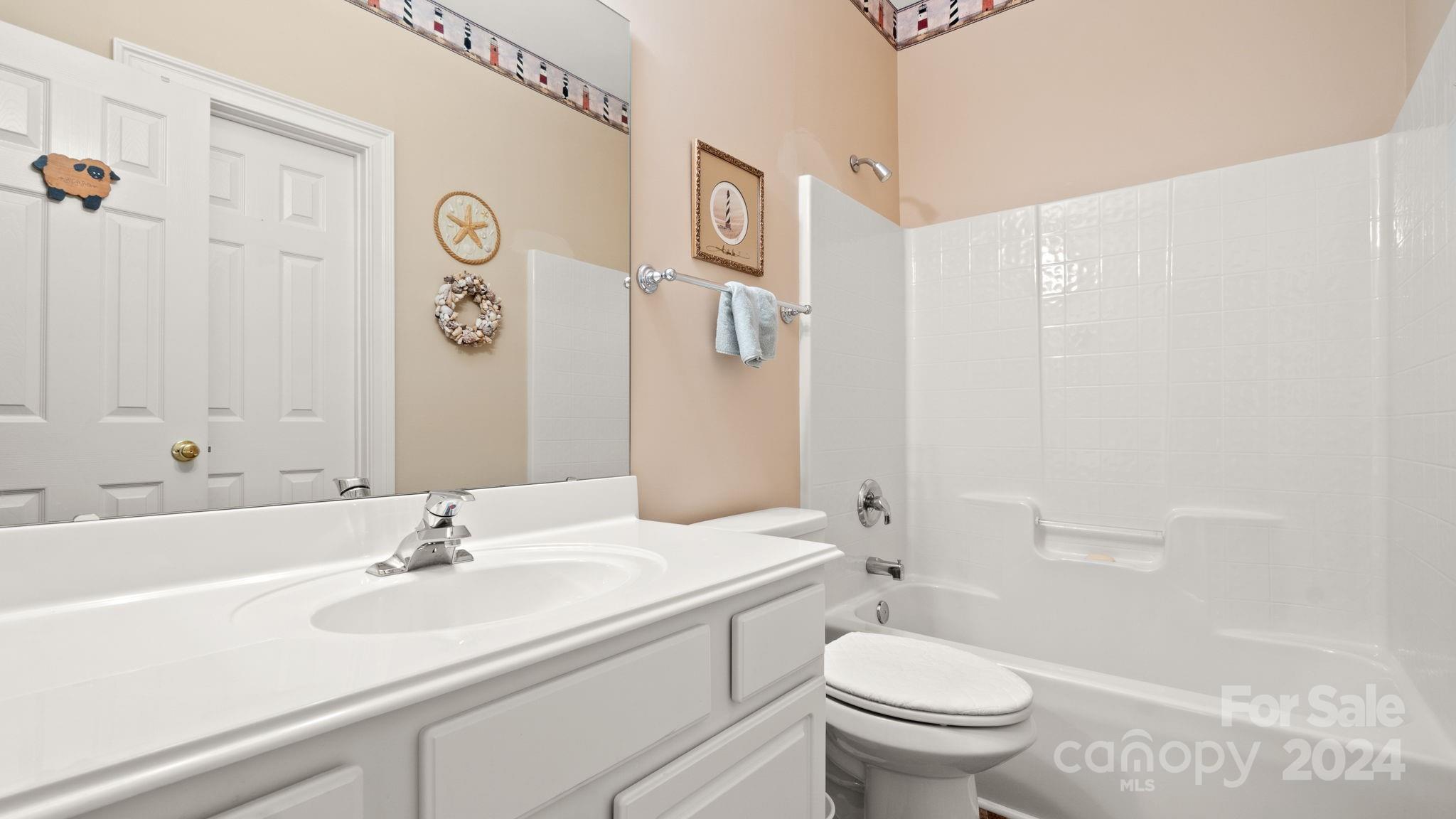 7121 Michael Scott Crossing Fort Mill, SC 29708 - Photo 35 of 46 a bathroom with a sink toilet and shower