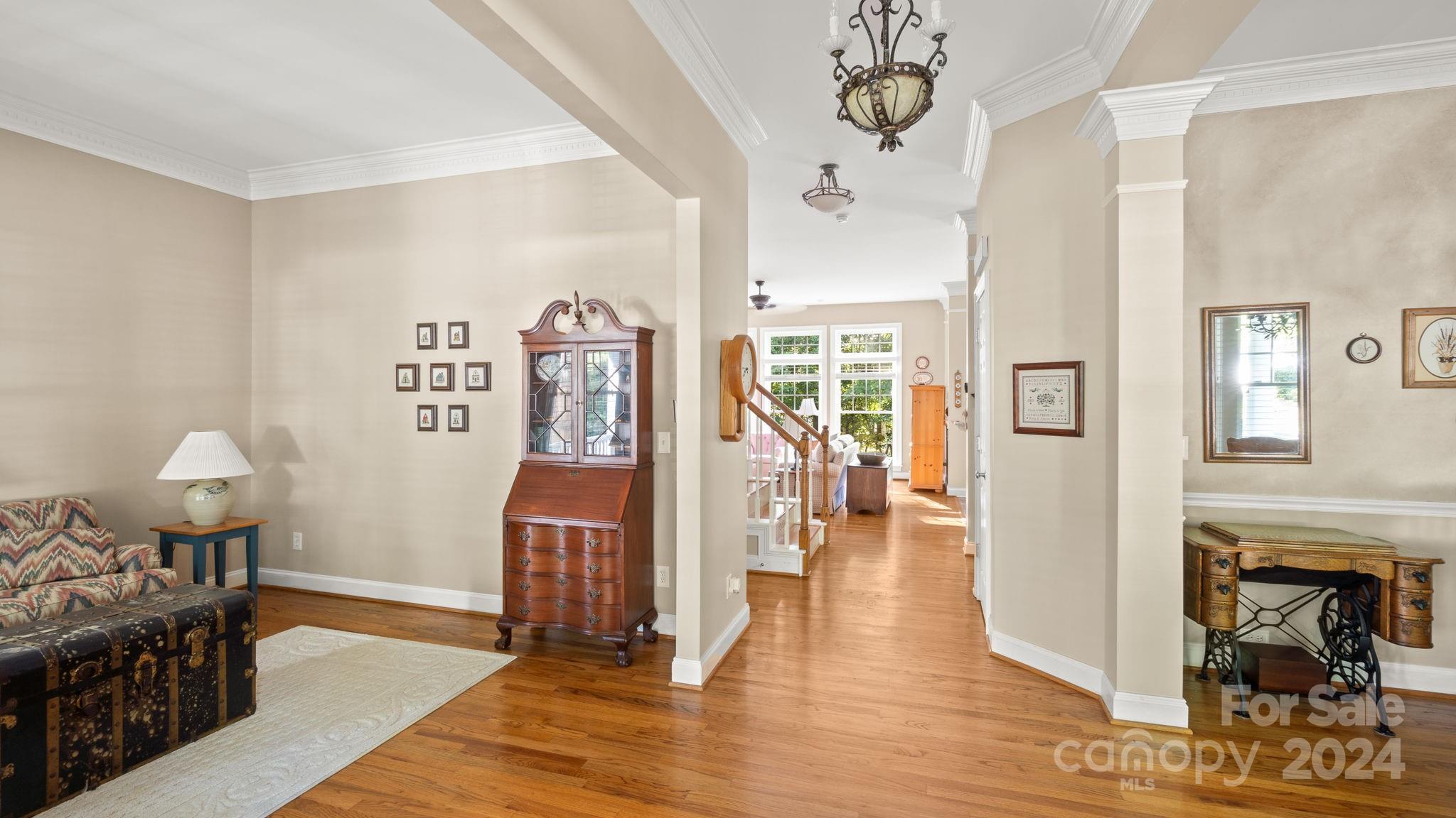 7121 Michael Scott Crossing Fort Mill, SC 29708 - Photo 7 of 46 a living room with furniture and wooden floor