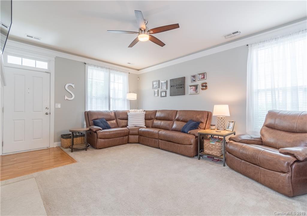 4222 Vance Road North Huntersville, NC 28078 - Photo 2 of 36 a living room with furniture a ceiling fan and a window