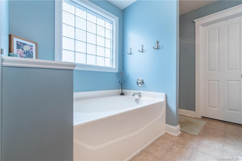 4222 Vance Road North Huntersville, NC 28078 - Photo 16 of 36 a spacious bathroom with a bathtub and window