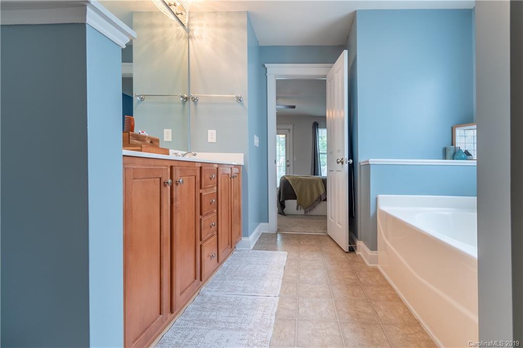 4222 Vance Road North Huntersville, NC 28078 - Photo 17 of 36 a bathroom with a tub and shower
