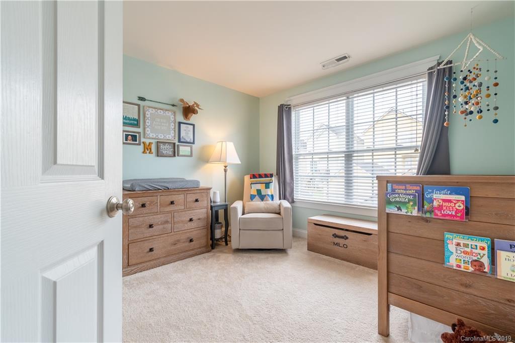 4222 Vance Road North Huntersville, NC 28078 - Photo 18 of 36 a room with furniture and baby crib