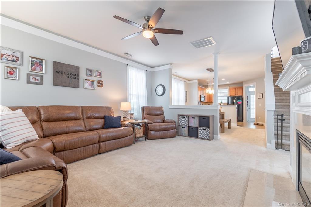 4222 Vance Road North Huntersville, NC 28078 - Photo 3 of 36 a living room with furniture and a fireplace