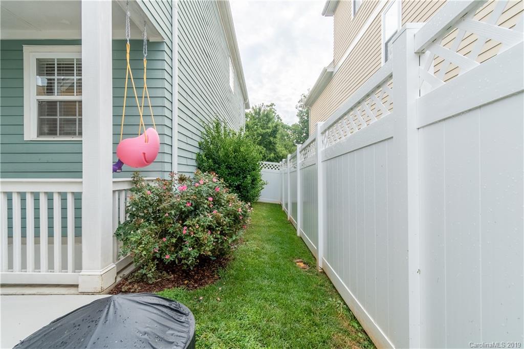 4222 Vance Road North Huntersville, NC 28078 - Photo 26 of 36 a backyard of a house with plants and outdoor seating