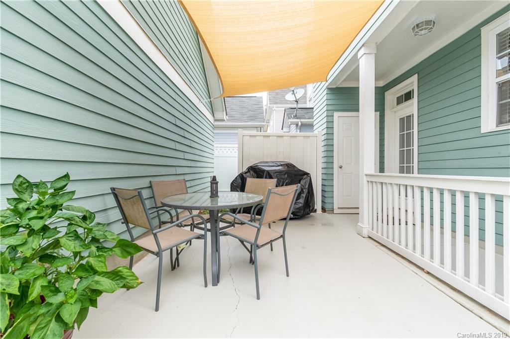 4222 Vance Road North Huntersville, NC 28078 - Photo 27 of 36 a view of backyard with a table and chairs and potted plants