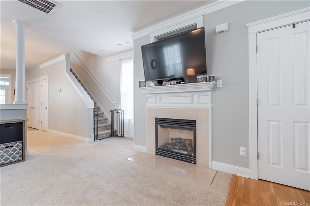 4222 Vance Road North Huntersville, NC 28078 - Photo 4 of 36 a living room with furniture and a fireplace