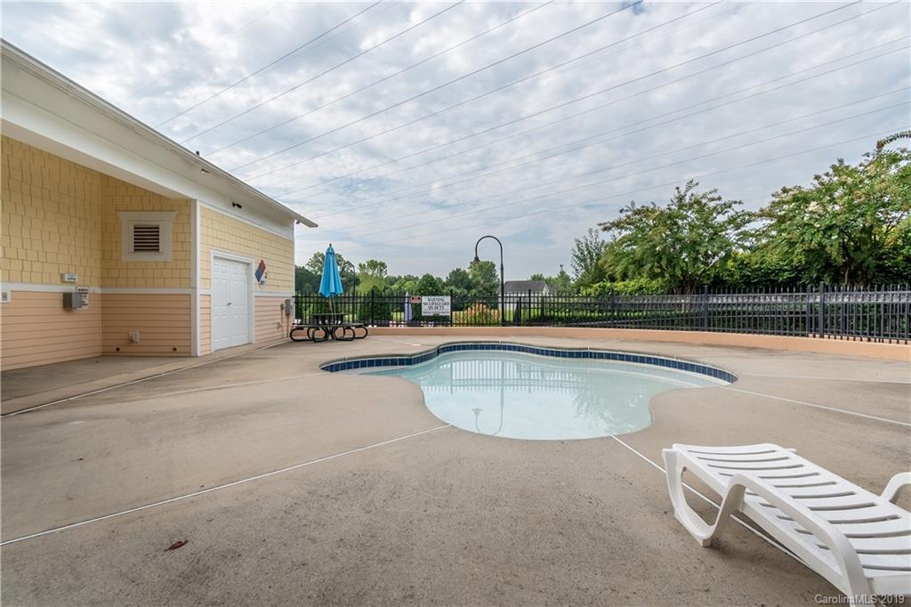 4222 Vance Road North Huntersville, NC 28078 - Photo 35 of 36 a view of a swimming pool with a lawn chairs and a yard