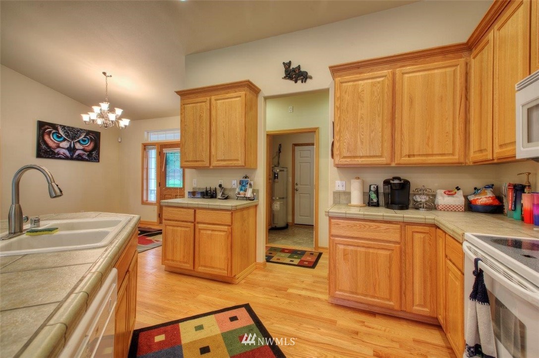 5809 Stringtown Road East Eatonville, WA 98328 - Photo 11 of 28 a kitchen with a sink cabinets and appliances