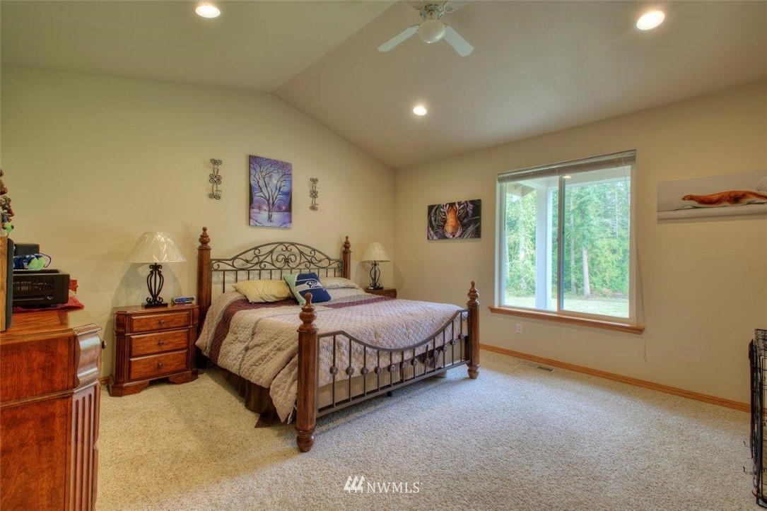 5809 Stringtown Road East Eatonville, WA 98328 - Photo 12 of 28 a spacious bedroom with a bed and a window