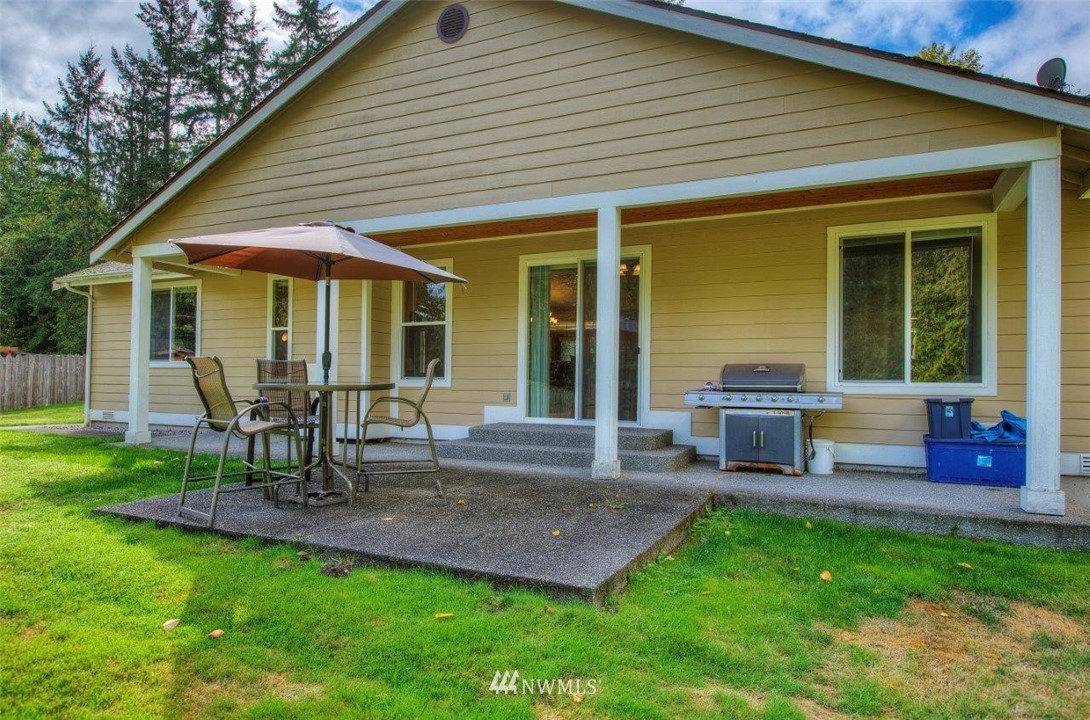 5809 Stringtown Road East Eatonville, WA 98328 - Photo 20 of 28 a view of a house with backyard and sitting area
