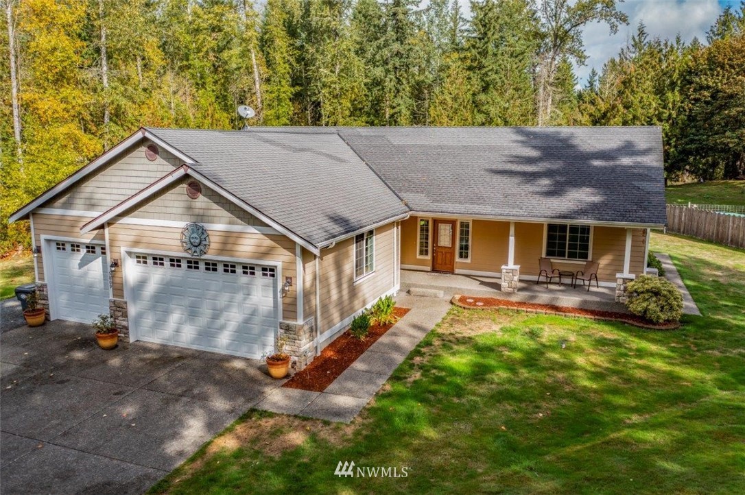 5809 Stringtown Road East Eatonville, WA 98328 - Photo 23 of 28 a backyard of a house with yard and outdoor seating