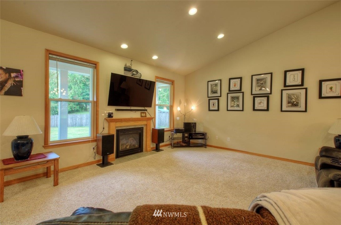 5809 Stringtown Road East Eatonville, WA 98328 - Photo 6 of 28 a living room with furniture and a fireplace