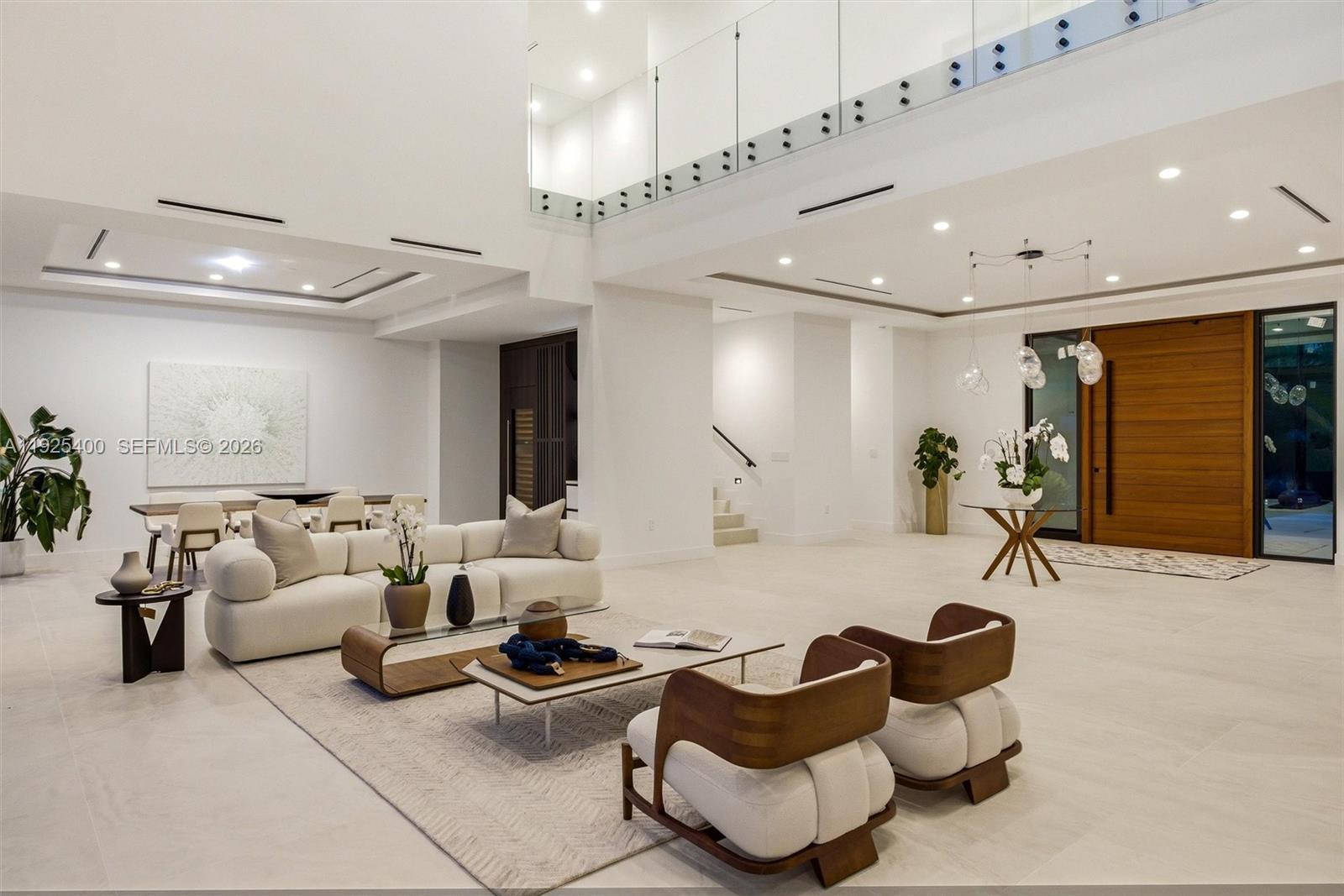 9840 Southwest 73rd Court Pinecrest, FL 33156 - Photo 16 of 67 Luxury Living Room | Double-Height Ceiling | Glass Balcony | Pivot Entry Door