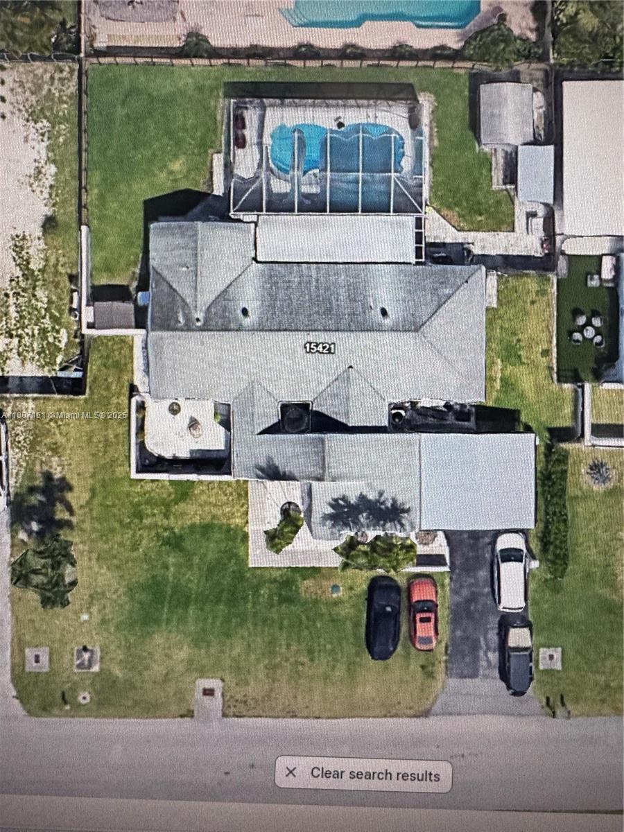 15421 Southwest 158th Street Miami, FL 33187 - Photo 29 of 31 an aerial view of a house with garden space and street view