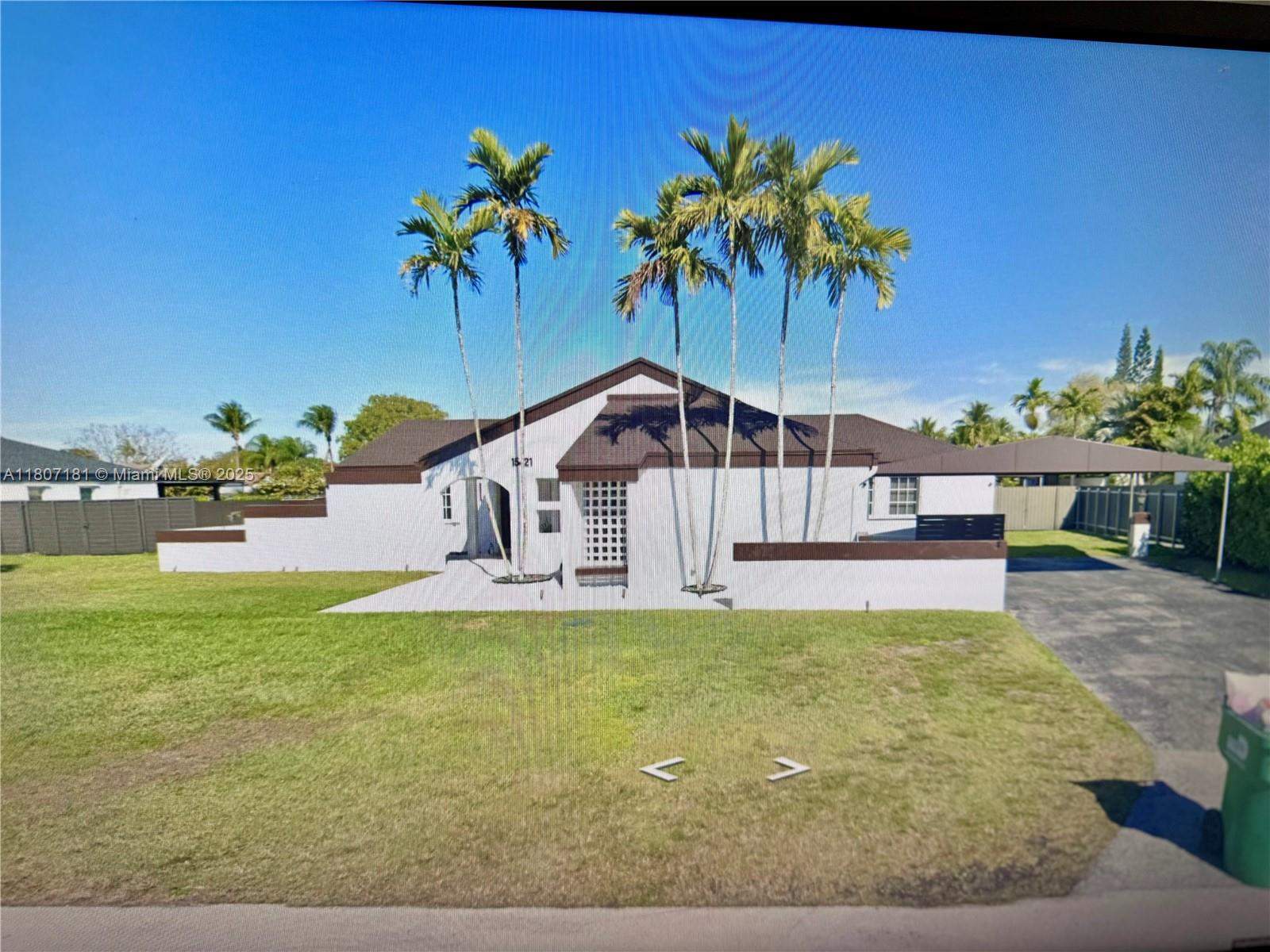 15421 Southwest 158th Street Miami, FL 33187 - Photo 30 of 31 a view of a swimming pool with a yard