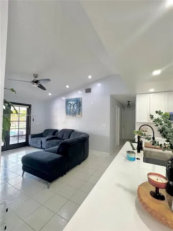 a living room with furniture window and a couch