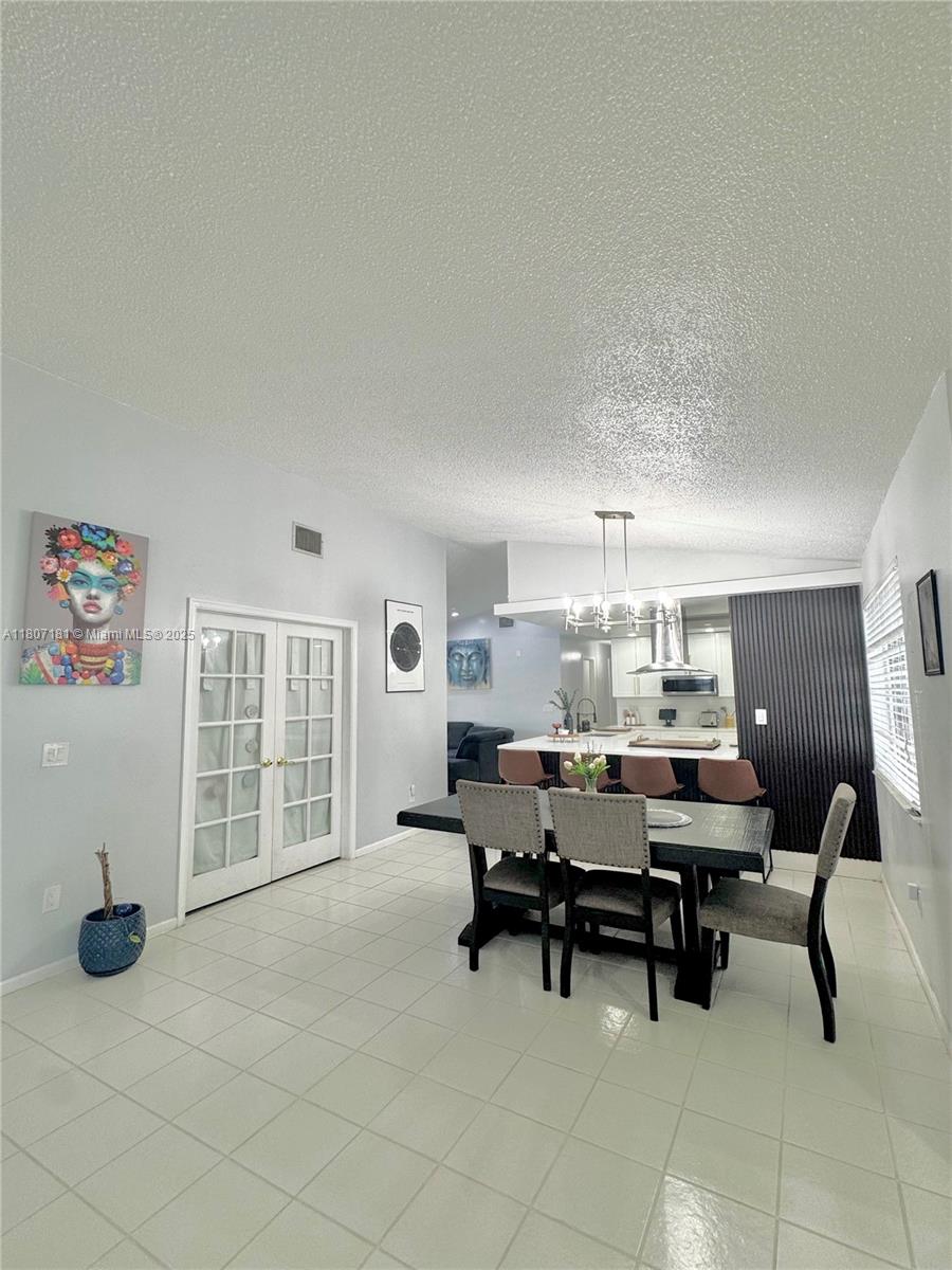 15421 Southwest 158th Street Miami, FL 33187 - Photo 9 of 31 a view of a workspace with furniture and a window