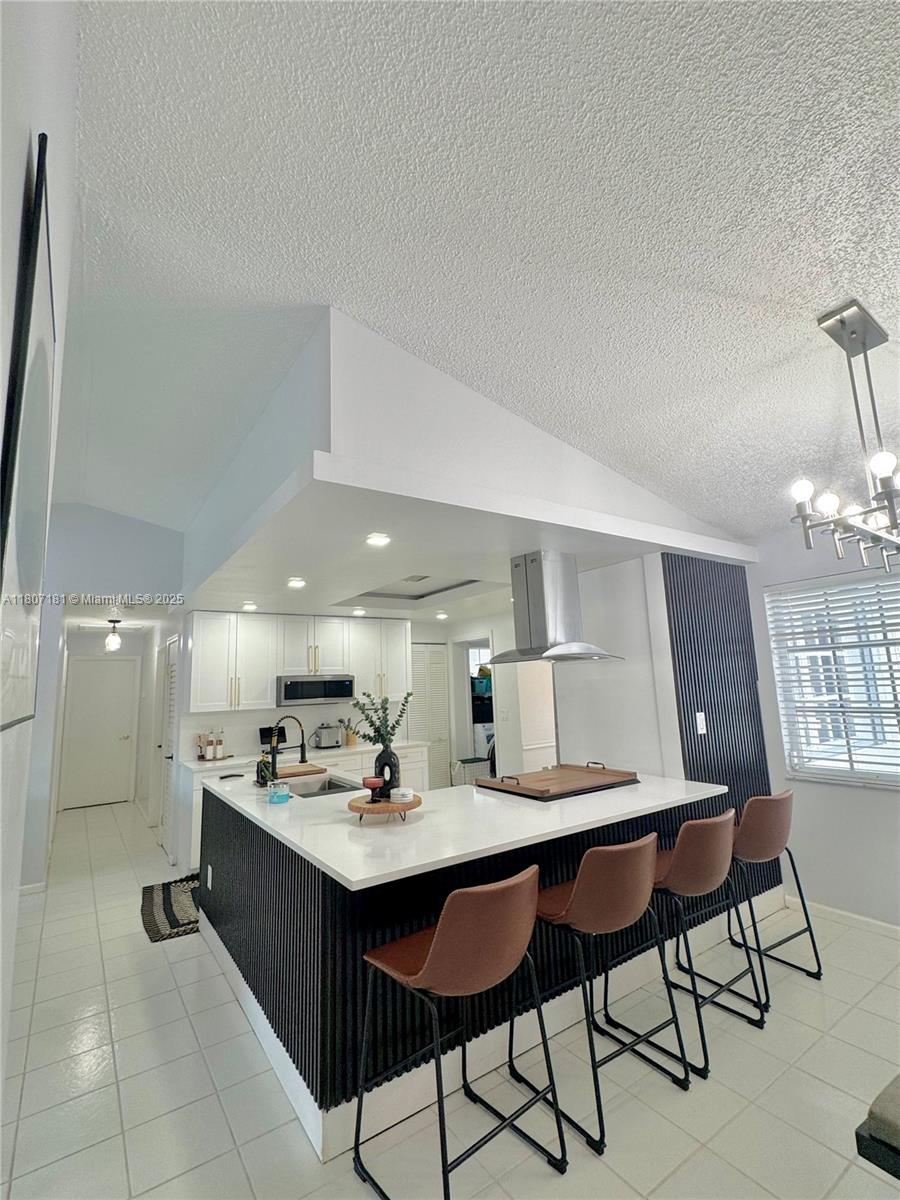 15421 Southwest 158th Street Miami, FL 33187 - Photo 10 of 31 a kitchen with a sink cabinets and window