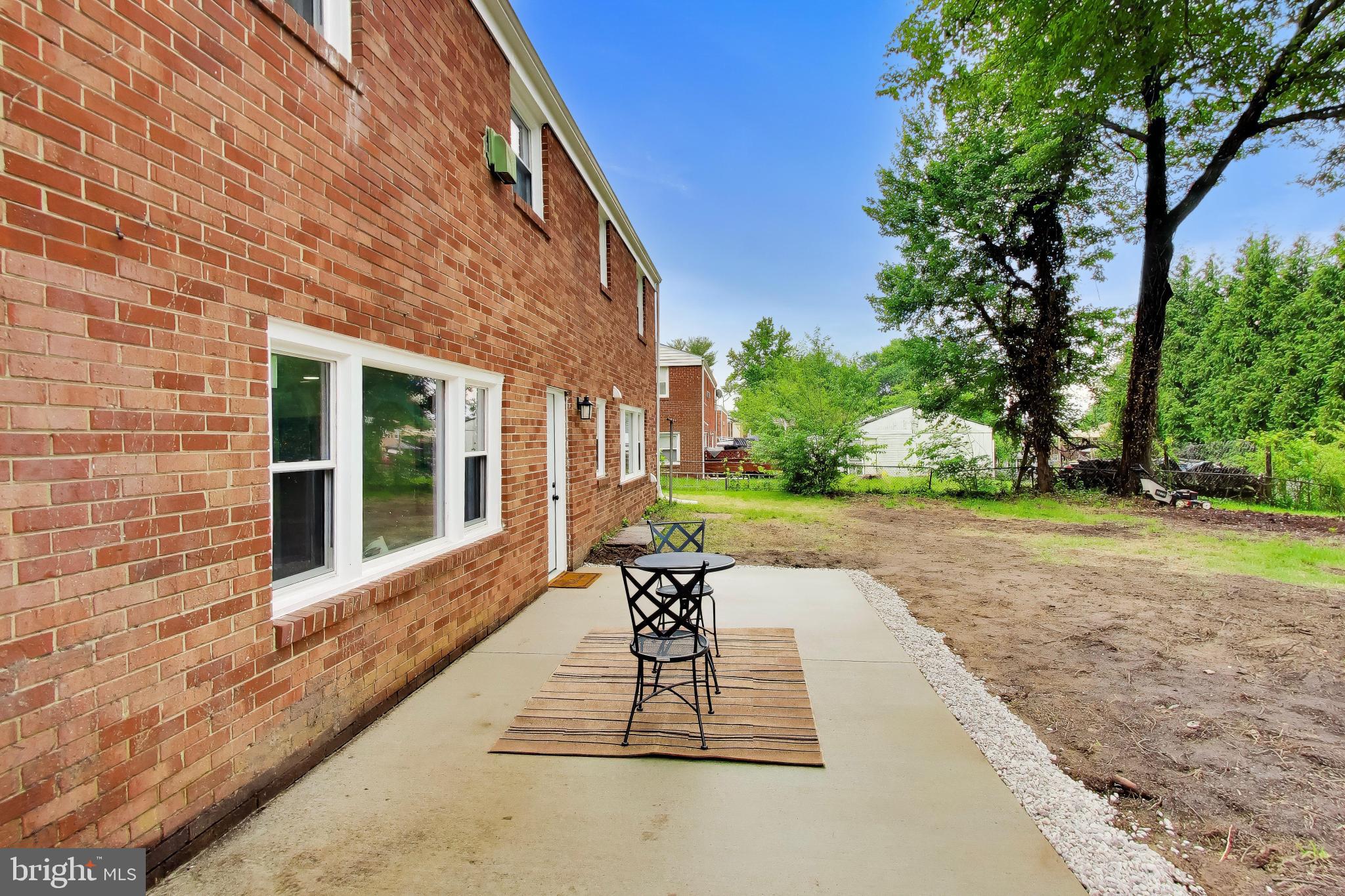 11309 Keystone Avenue Clinton, MD 20735 - Photo 31 of 36 a view of a patio with a table and chairs and potted plants
