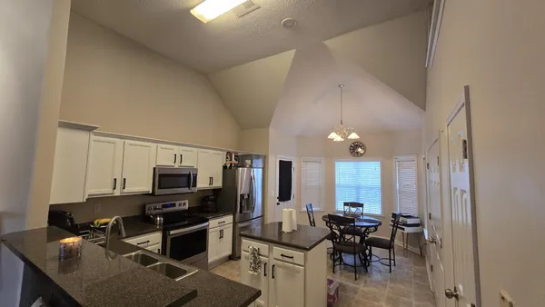 a view of a workspace with furniture