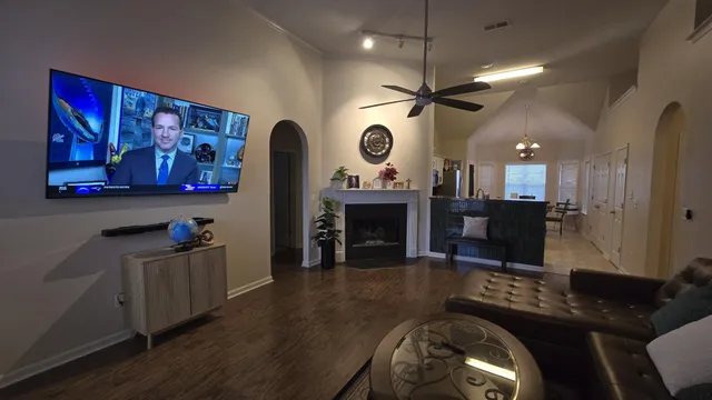 a living room with furniture and a fireplace