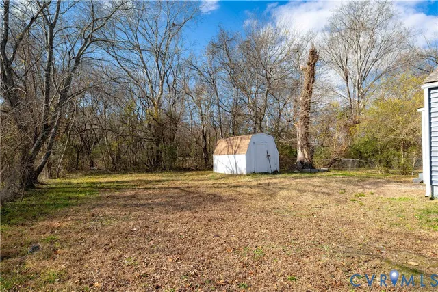a big yard with large trees