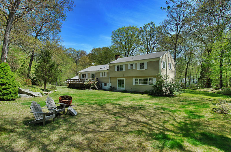 154 South Bald Hill Road New Canaan, CT 06840 - Photo 13 of 21 a view of a house with a yard and sitting area