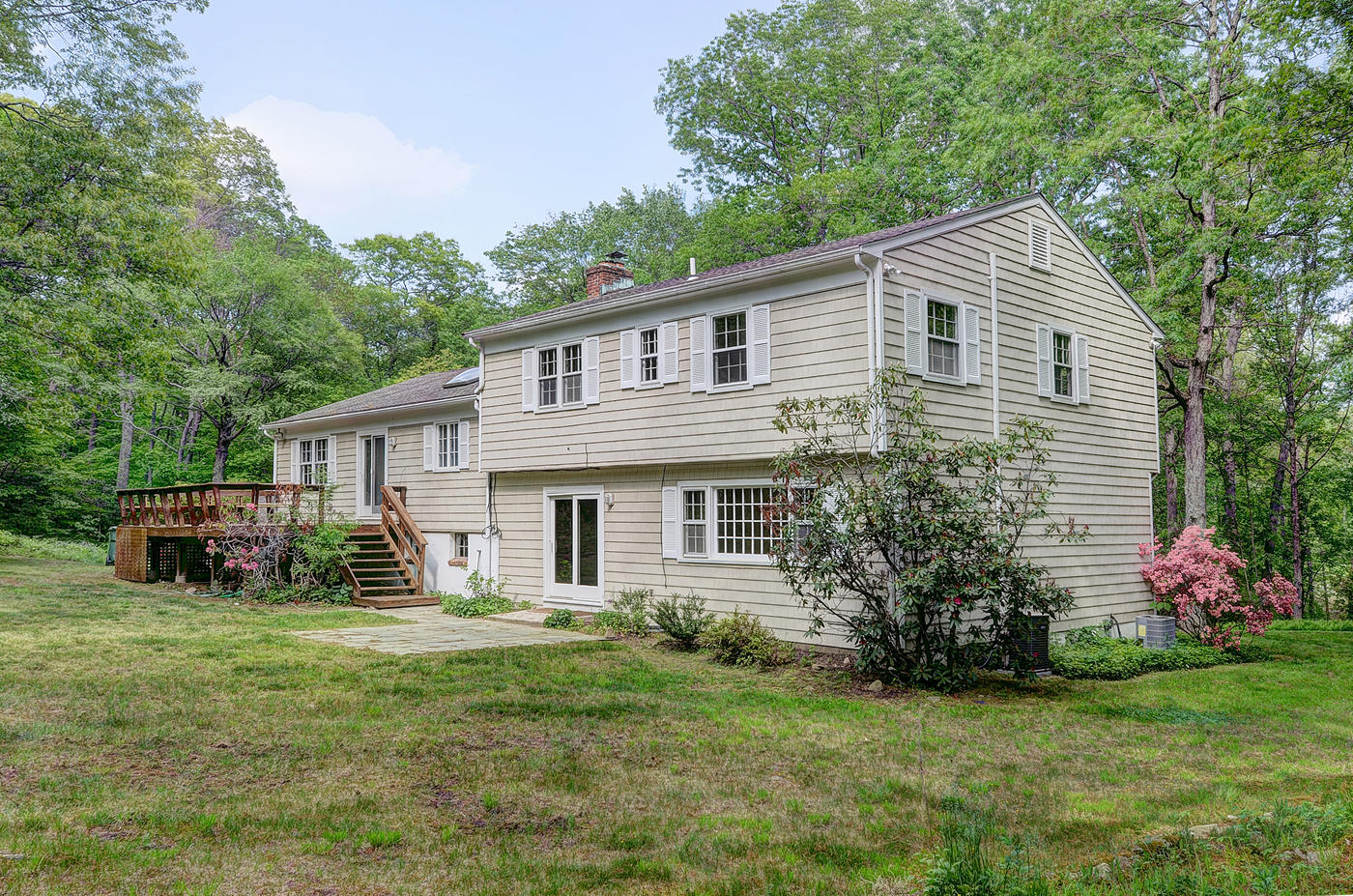 154 South Bald Hill Road New Canaan, CT 06840 - Photo 14 of 21 a front view of house with yard and green space