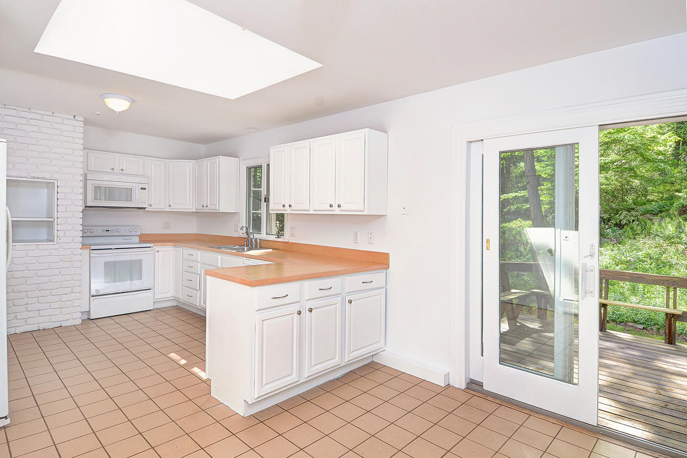 154 South Bald Hill Road New Canaan, CT 06840 - Photo 8 of 21 a kitchen with a stove a sink and a refrigerator
