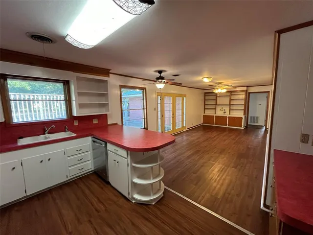 a room with gym equipment and windows