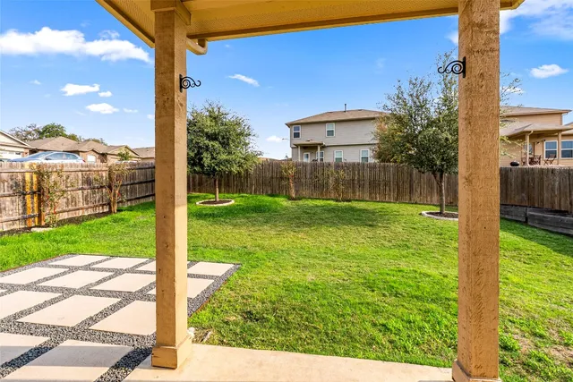 a view of a backyard with a garden and plants