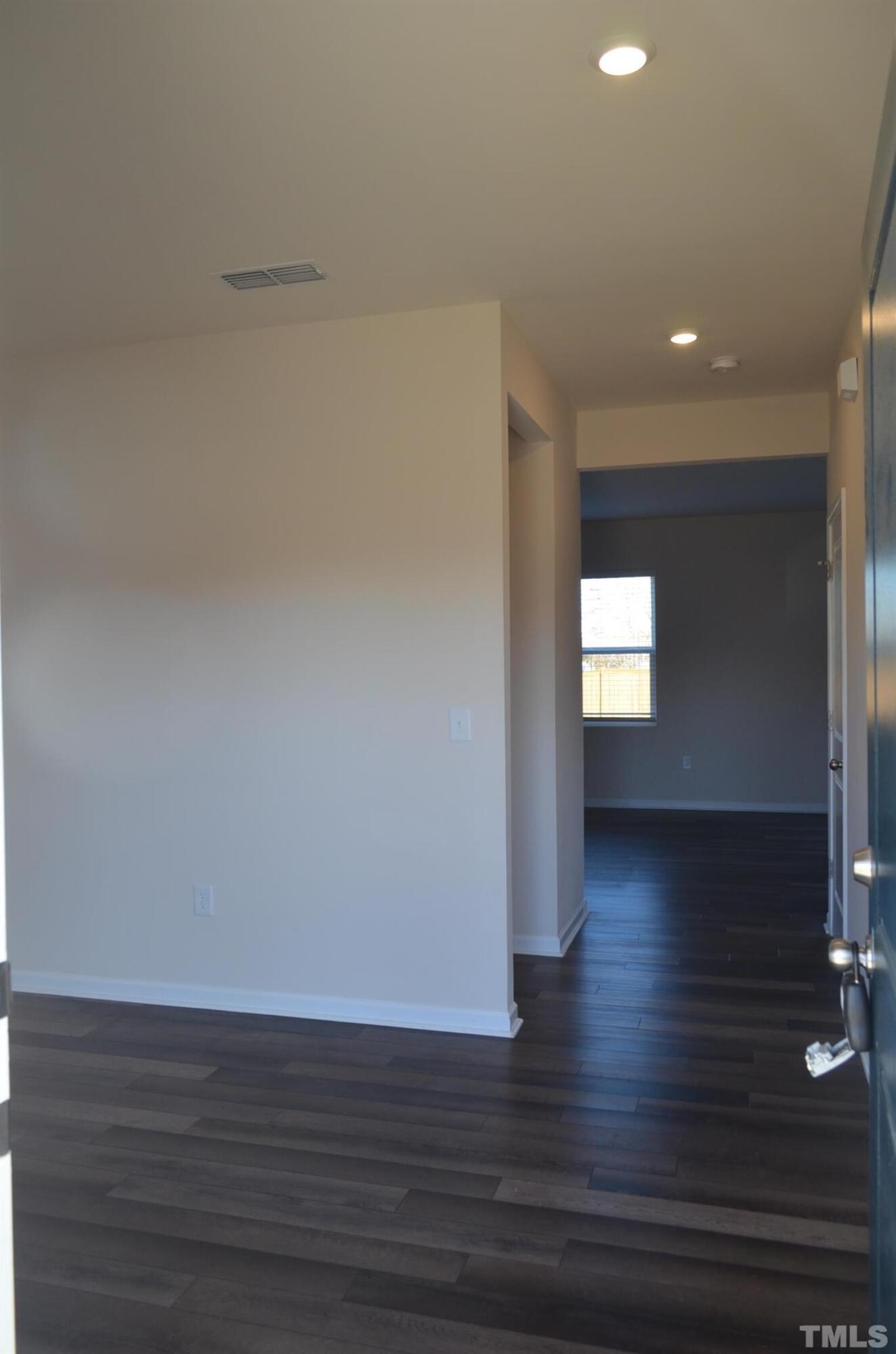 3537 Pinnacle Peak Drive Raleigh, NC 27604 - Photo 11 of 41 a view of wooden floor and windows in a room