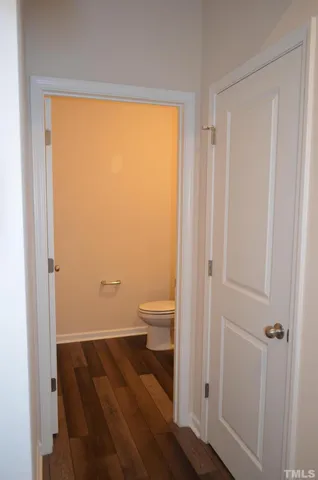 a white toilet sitting next to a white toilet