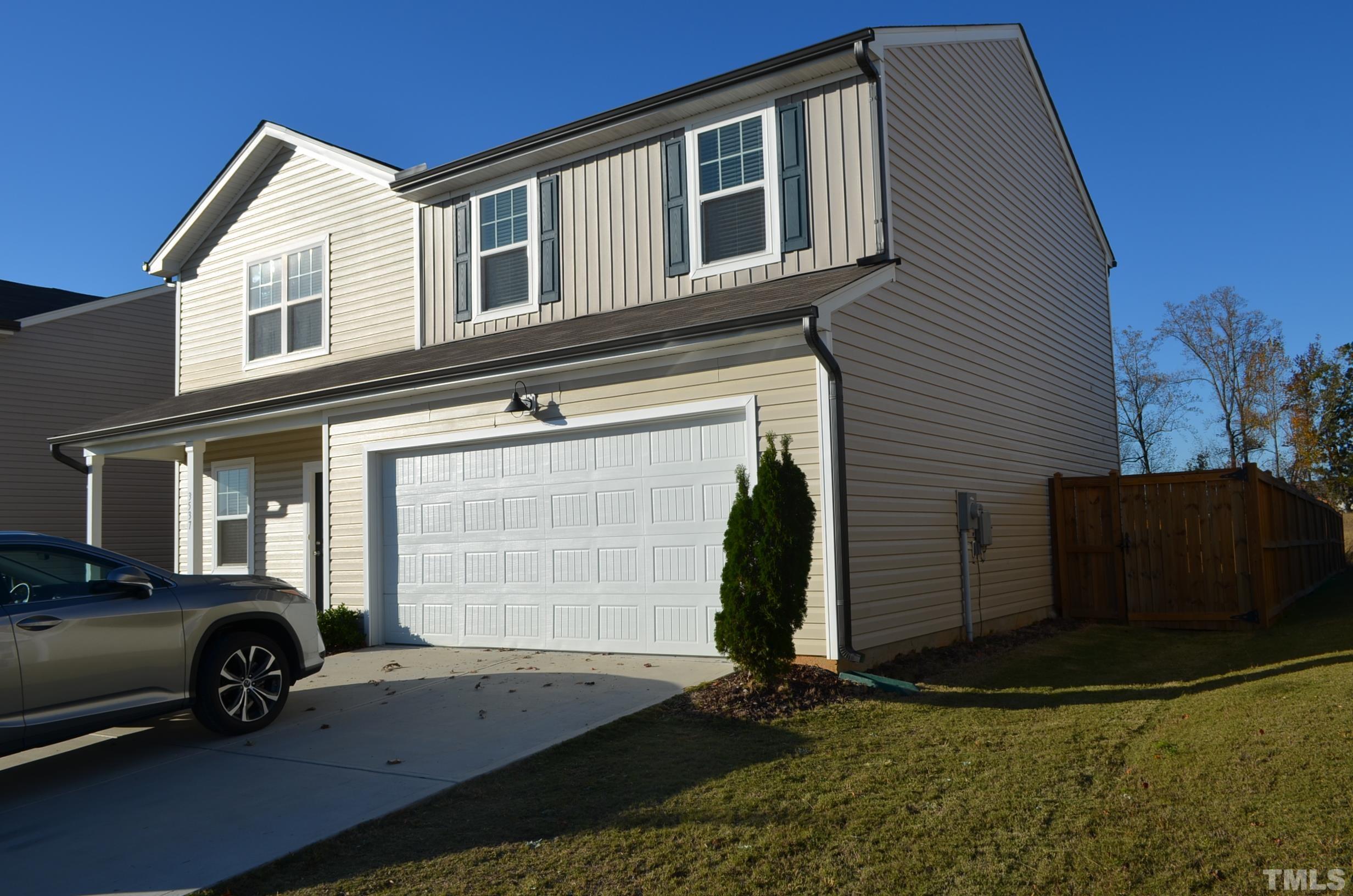 3537 Pinnacle Peak Drive Raleigh, NC 27604 - Photo 3 of 41 a view of a house with a barbeque and wooden fence