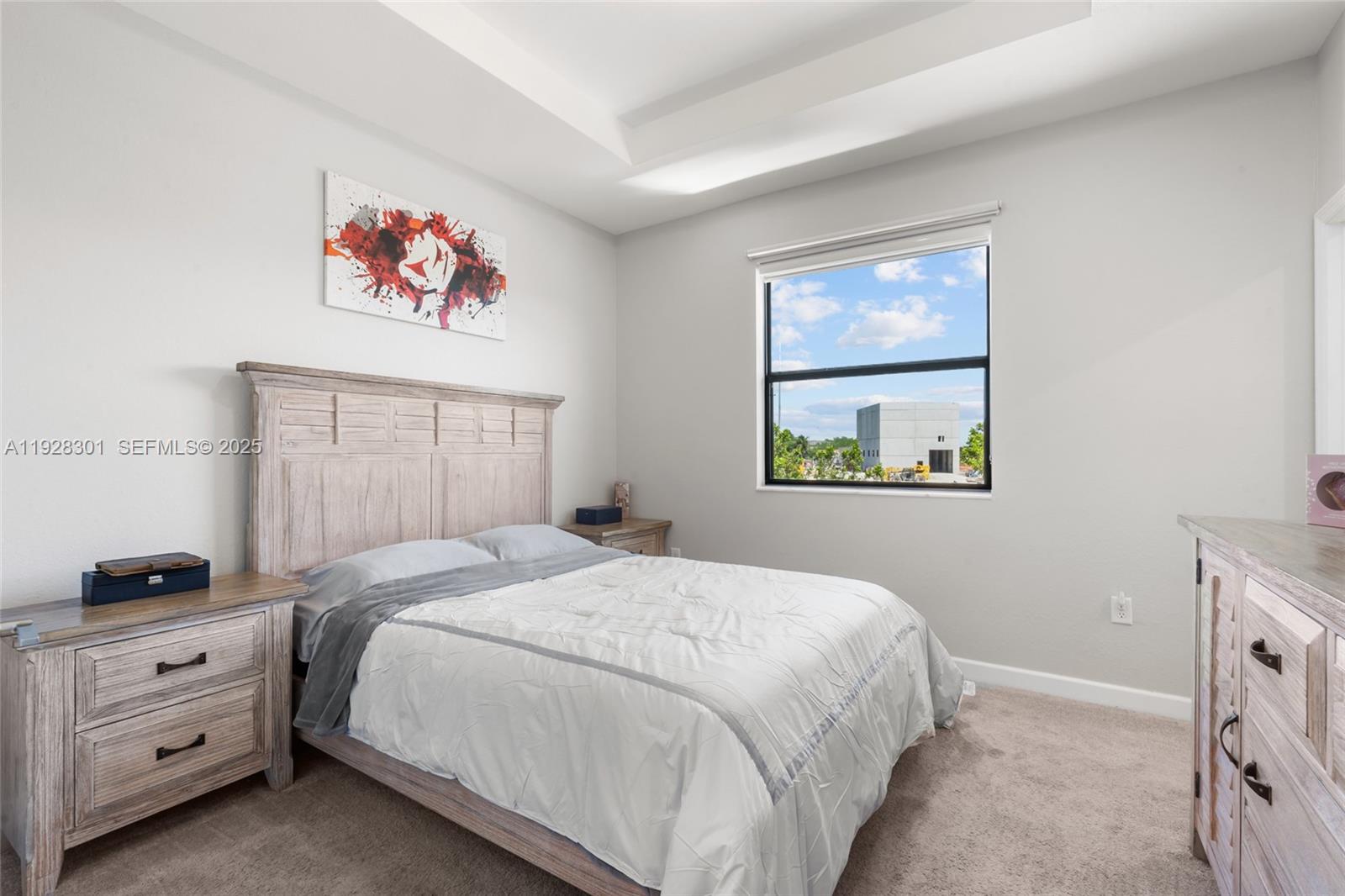 9917 Southwest 228th Terrace Miami, FL 33190 - Photo 13 of 36 a bedroom with a bed and a window