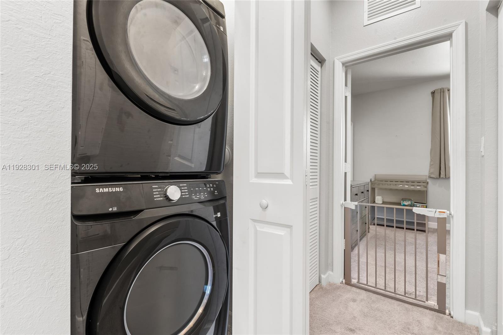 9917 Southwest 228th Terrace Miami, FL 33190 - Photo 17 of 36 a utility room with dryer and washer