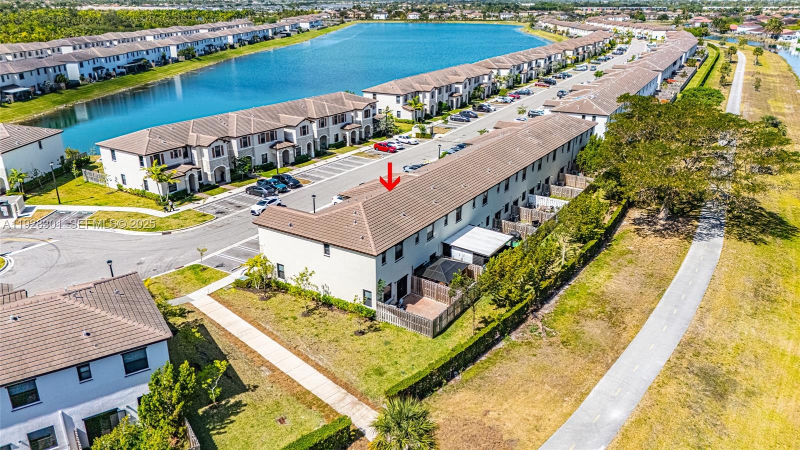 9917 Southwest 228th Terrace Miami, FL 33190 - Photo 24 of 36 a view of a house with a swimming pool
