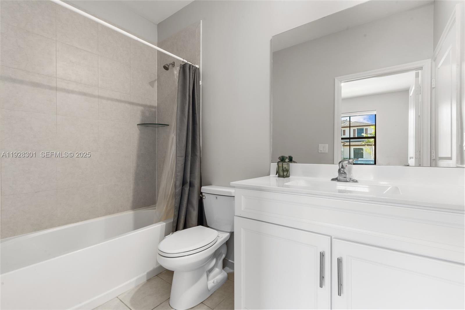 9917 Southwest 228th Terrace Miami, FL 33190 - Photo 26 of 36 a bathroom with a sink a toilet and shower