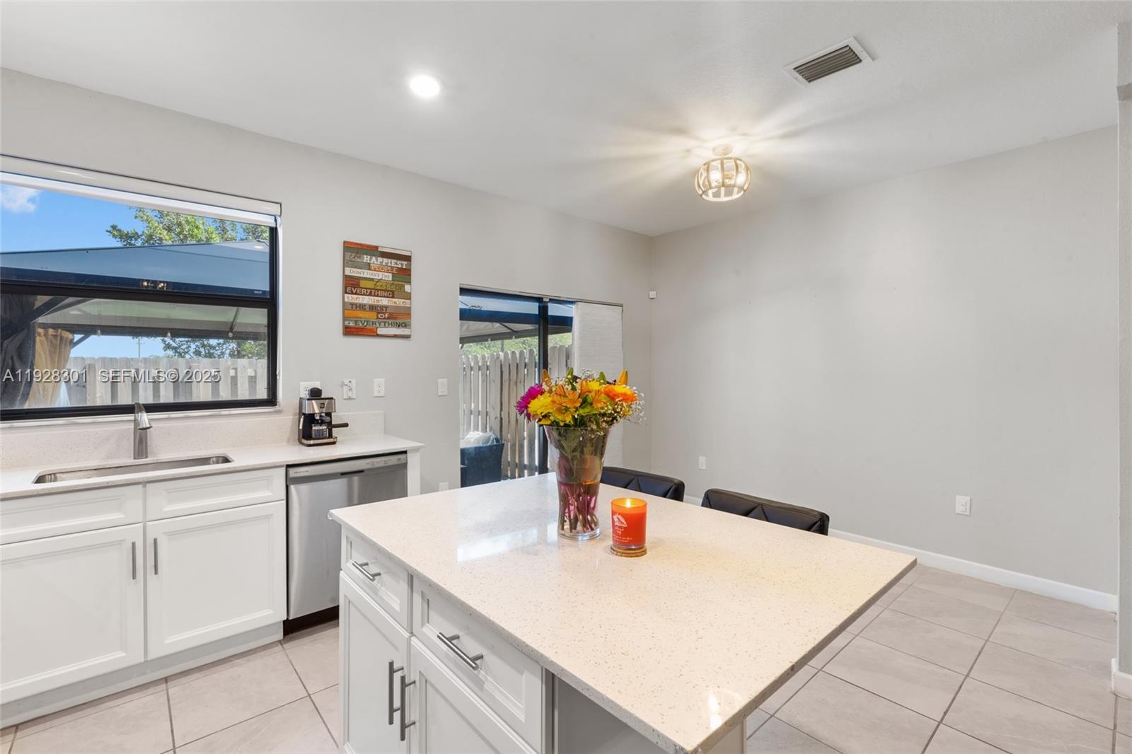 9917 Southwest 228th Terrace Miami, FL 33190 - Photo 31 of 36 a kitchen with a sink cabinets and appliances