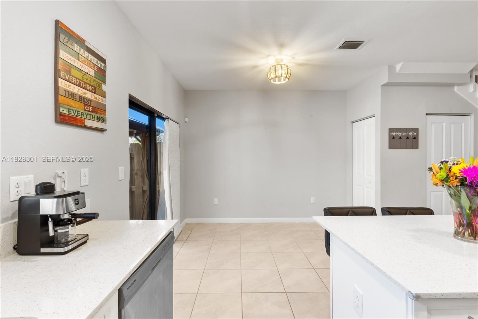 9917 Southwest 228th Terrace Miami, FL 33190 - Photo 34 of 36 a kitchen with a sink and cabinets