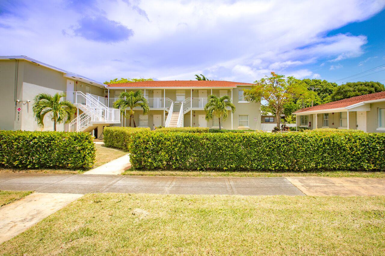 217 Butler Street, Unit 1 West Palm Beach, FL 33407 - Photo 1 of 9 a view of a swimming pool with an outdoor seating