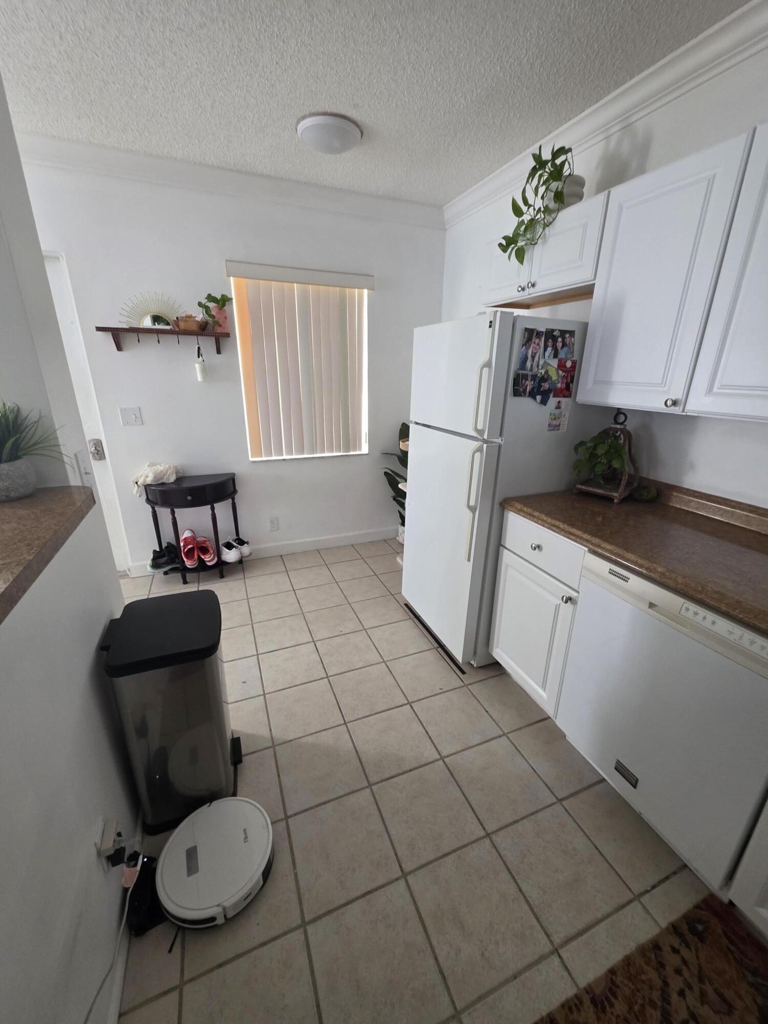 217 Butler Street, Unit 1 West Palm Beach, FL 33407 - Photo 7 of 9 a bathroom with a toilet and a sink