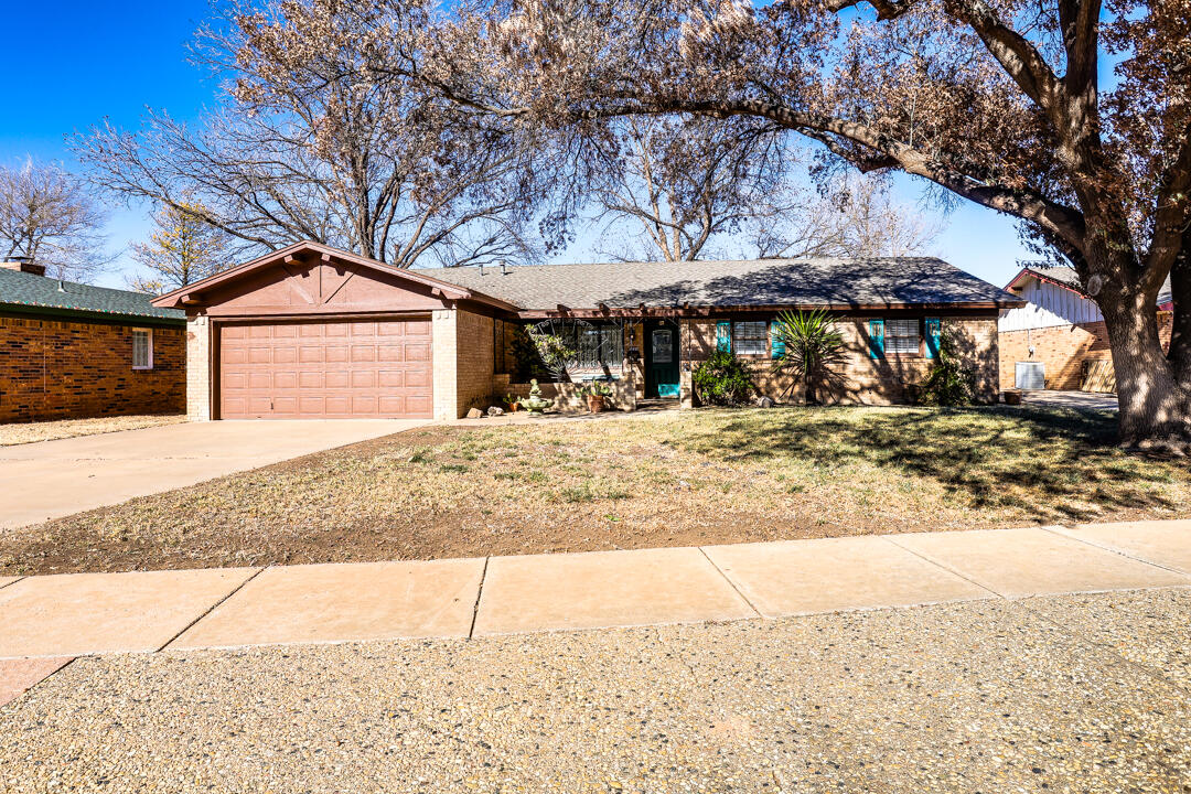 a wooden bench sitting in front of a house