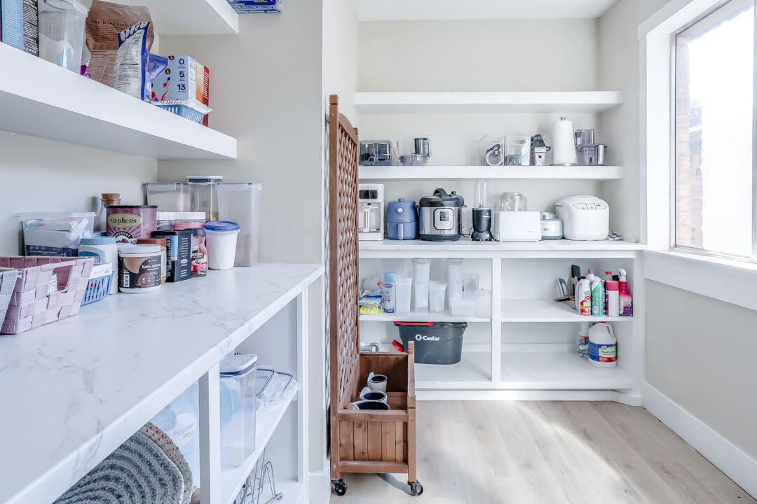 4306 57th Street Lubbock, TX 79413 - Photo 13 of 23 a room with furniture a rug and a window