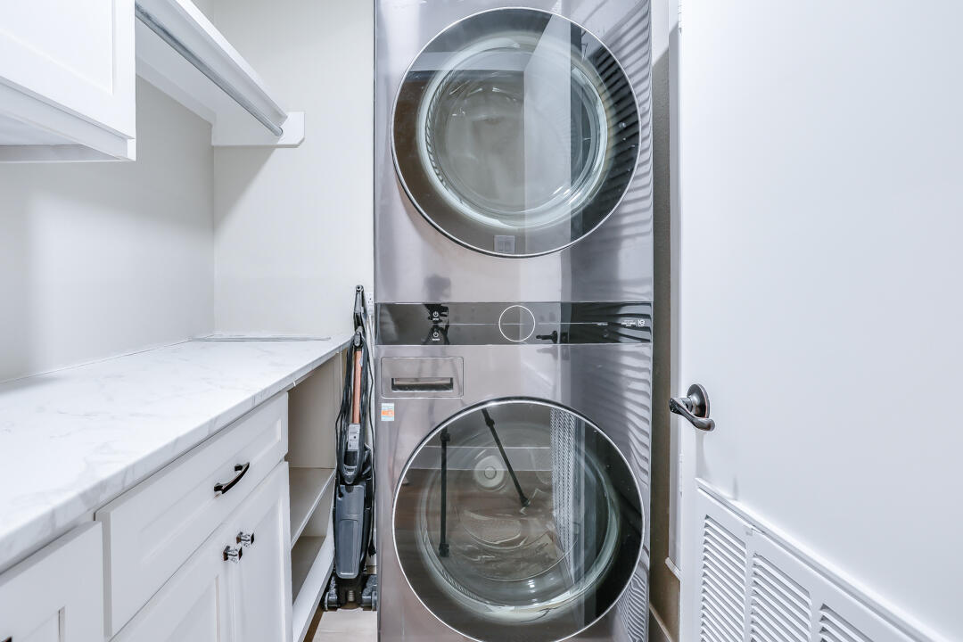 4306 57th Street Lubbock, TX 79413 - Photo 14 of 23 a utility room with sink dryer and washer