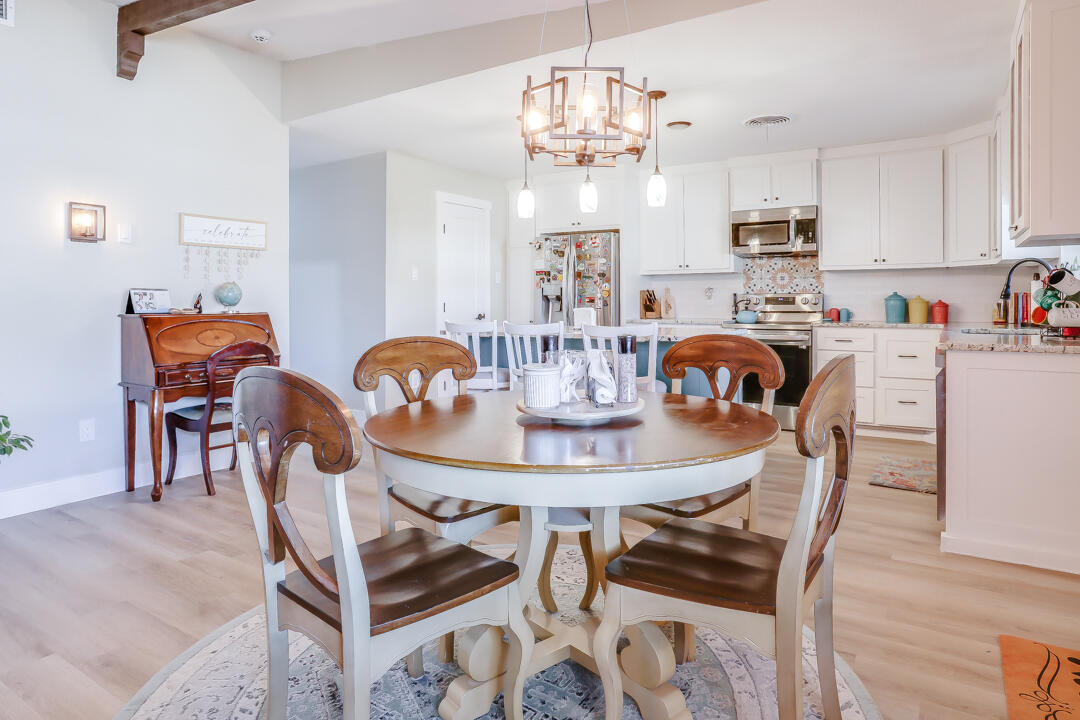 4306 57th Street Lubbock, TX 79413 - Photo 19 of 23 a view of a dining room with furniture and chandelier