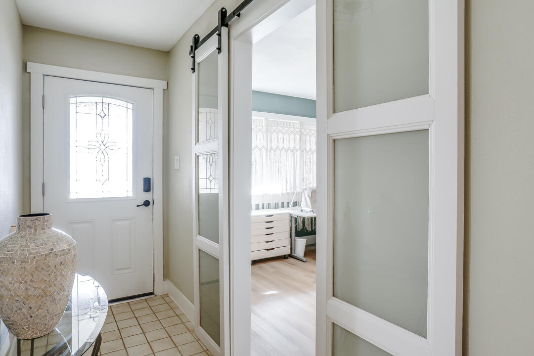 4306 57th Street Lubbock, TX 79413 - Photo 2 of 23 a bathroom with a glass door shower and a sink