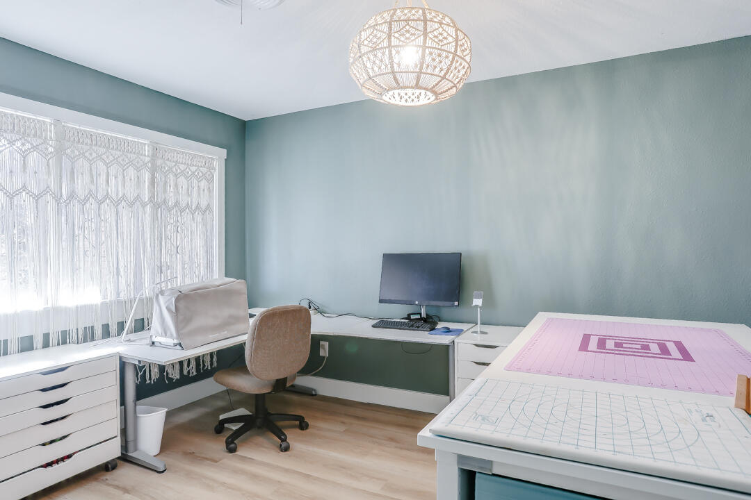 4306 57th Street Lubbock, TX 79413 - Photo 3 of 23 a view of a workspace with furniture and a window