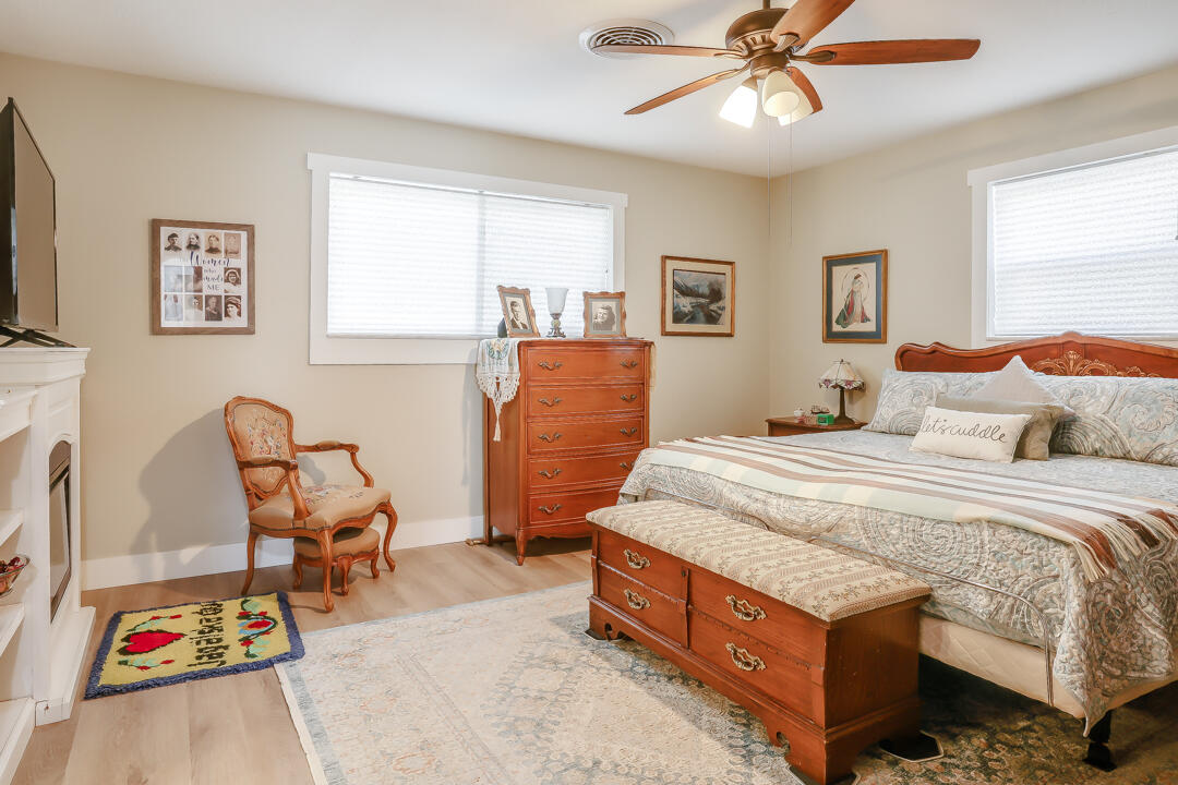 4306 57th Street Lubbock, TX 79413 - Photo 7 of 23 a bedroom with a bed and wooden floor