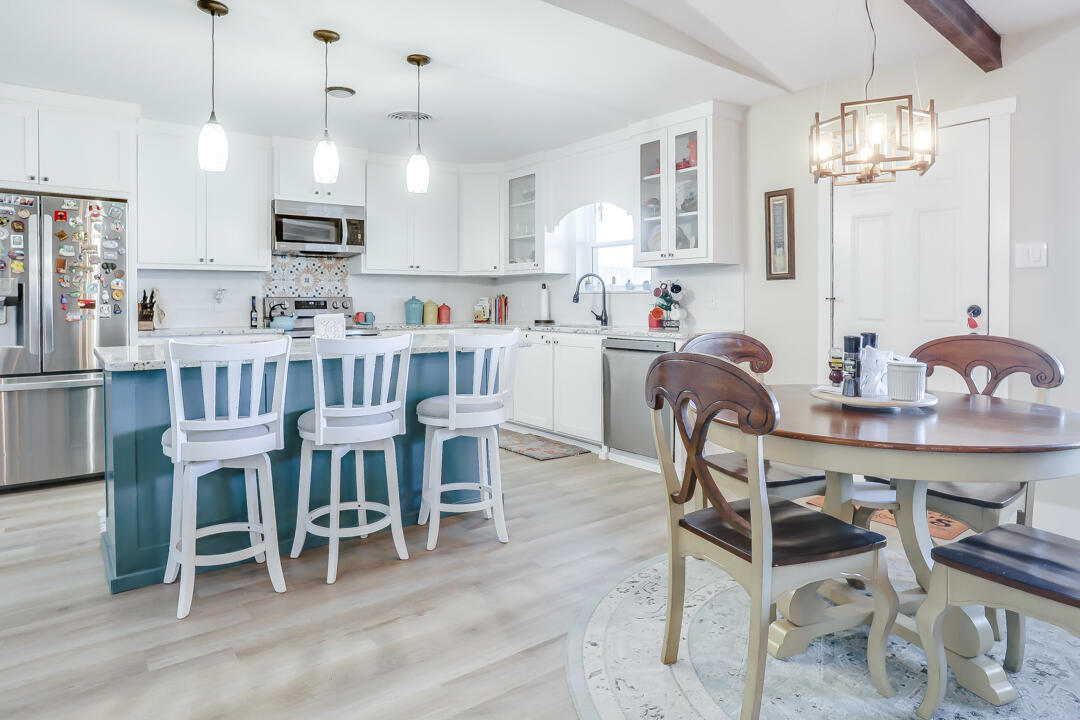 4306 57th Street Lubbock, TX 79413 - Photo 9 of 23 a view of kitchen with kitchen island dining table and stainless steel appliances